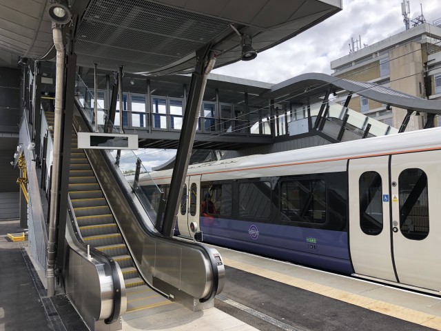 Crossrail Elizabeth line train on platform 3 at Abbey Wood Station. 
New Central Interchange Footbridge with escalators.